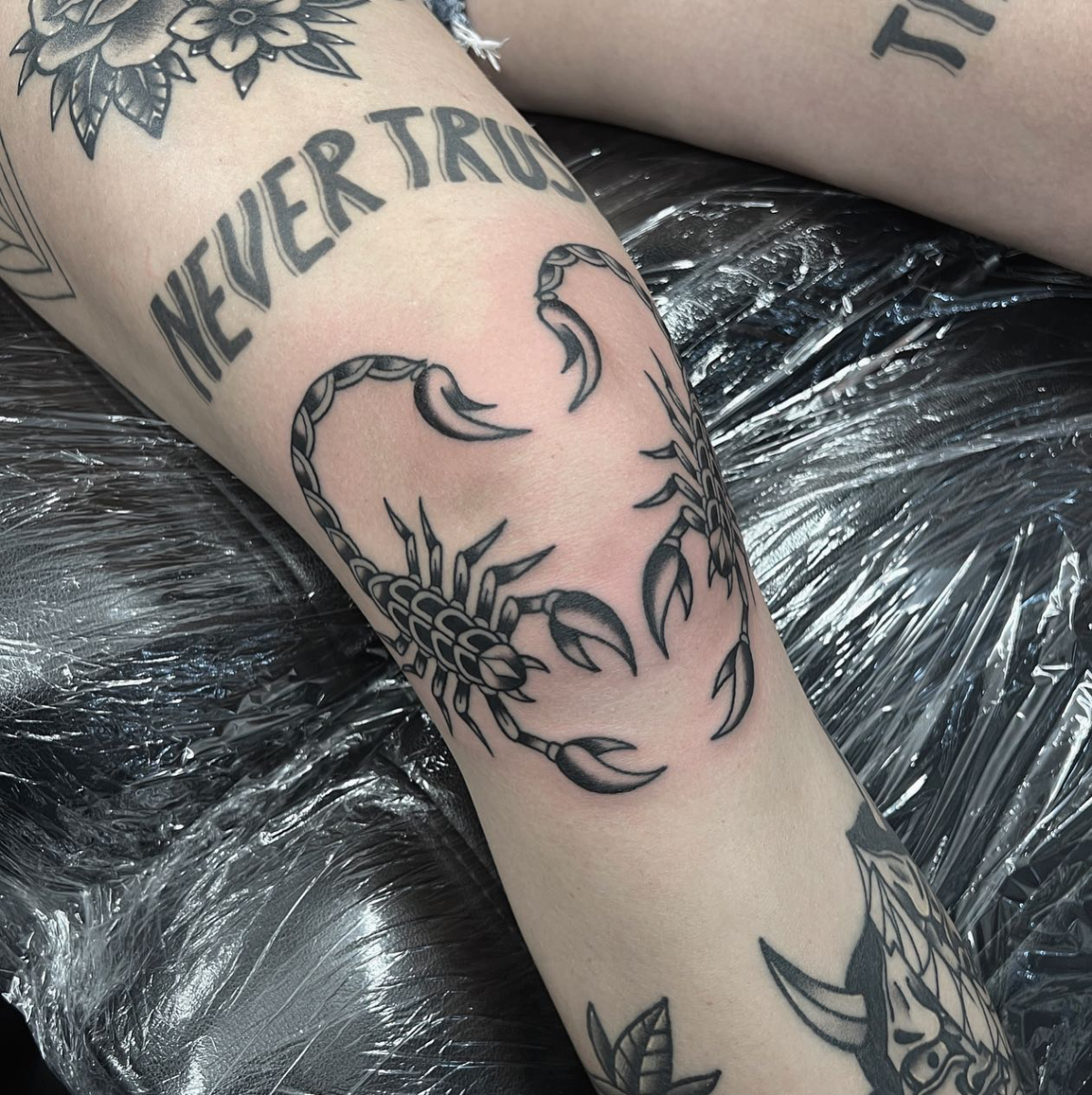 scorpion knee tattoo